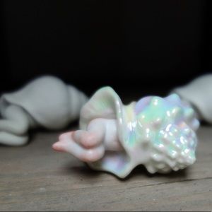 Handmade holographic creature in a shell porcelain